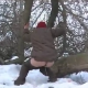 A drunk girl takes a piss out in the snow and ends up falling down on her ass.